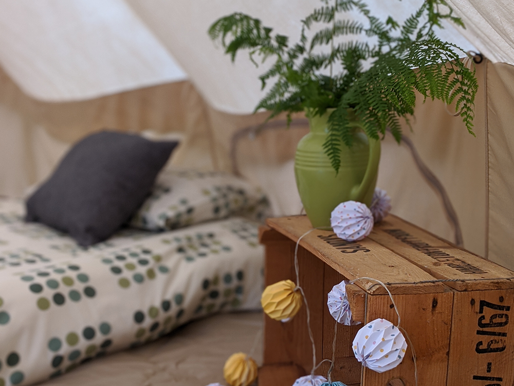 Inside of a glamping tent with beds